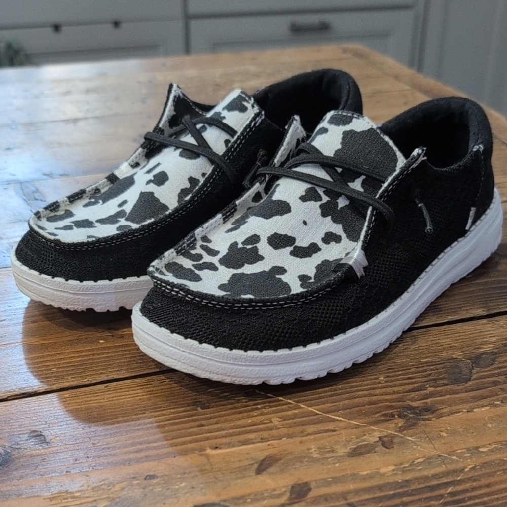 Hey Dude Black and White Cow Print Sneakers